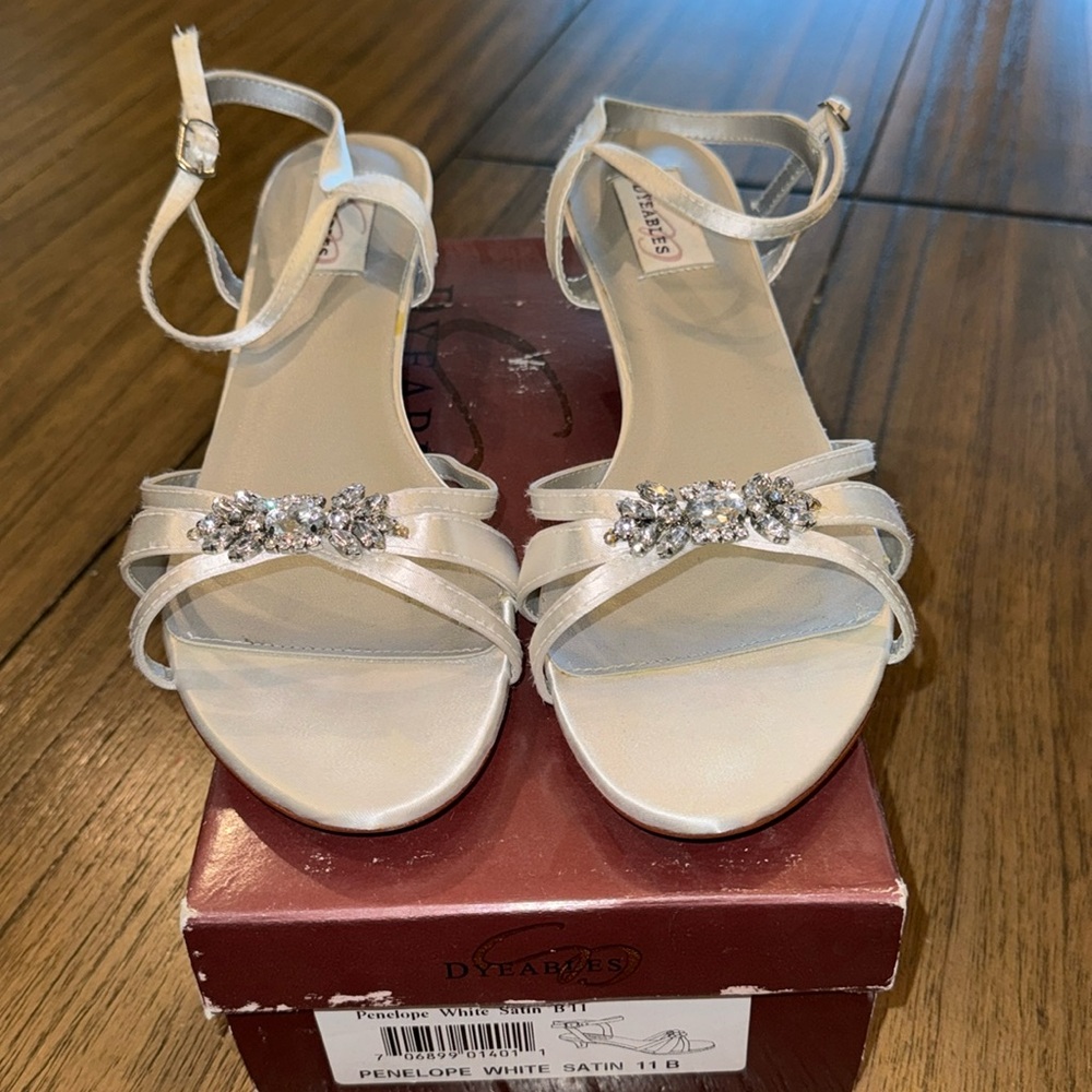White Satin shoes in good used condition. Worn once for wedding. 2 inch heel.
